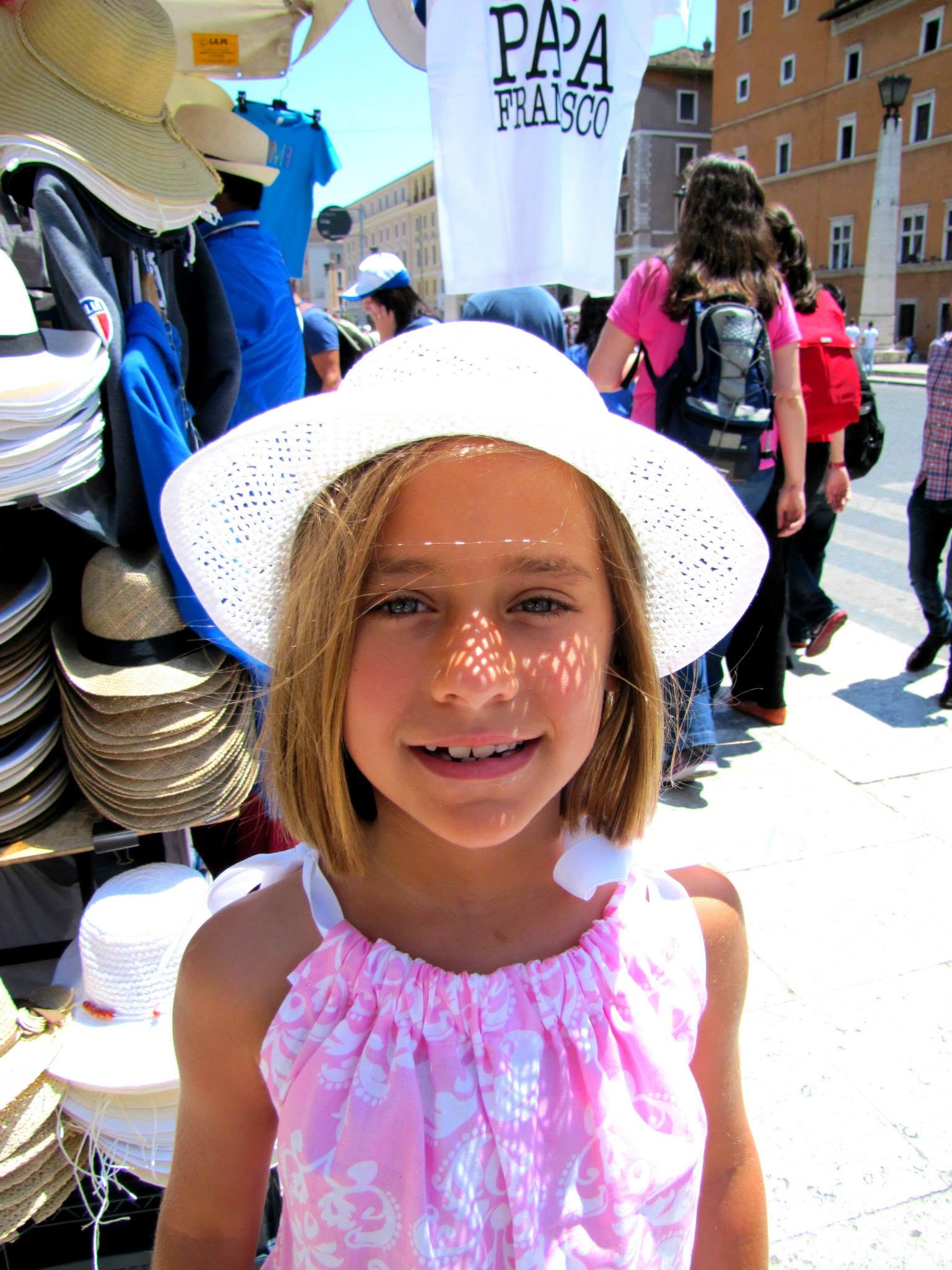 Lisa picking out a sun hat in Rome