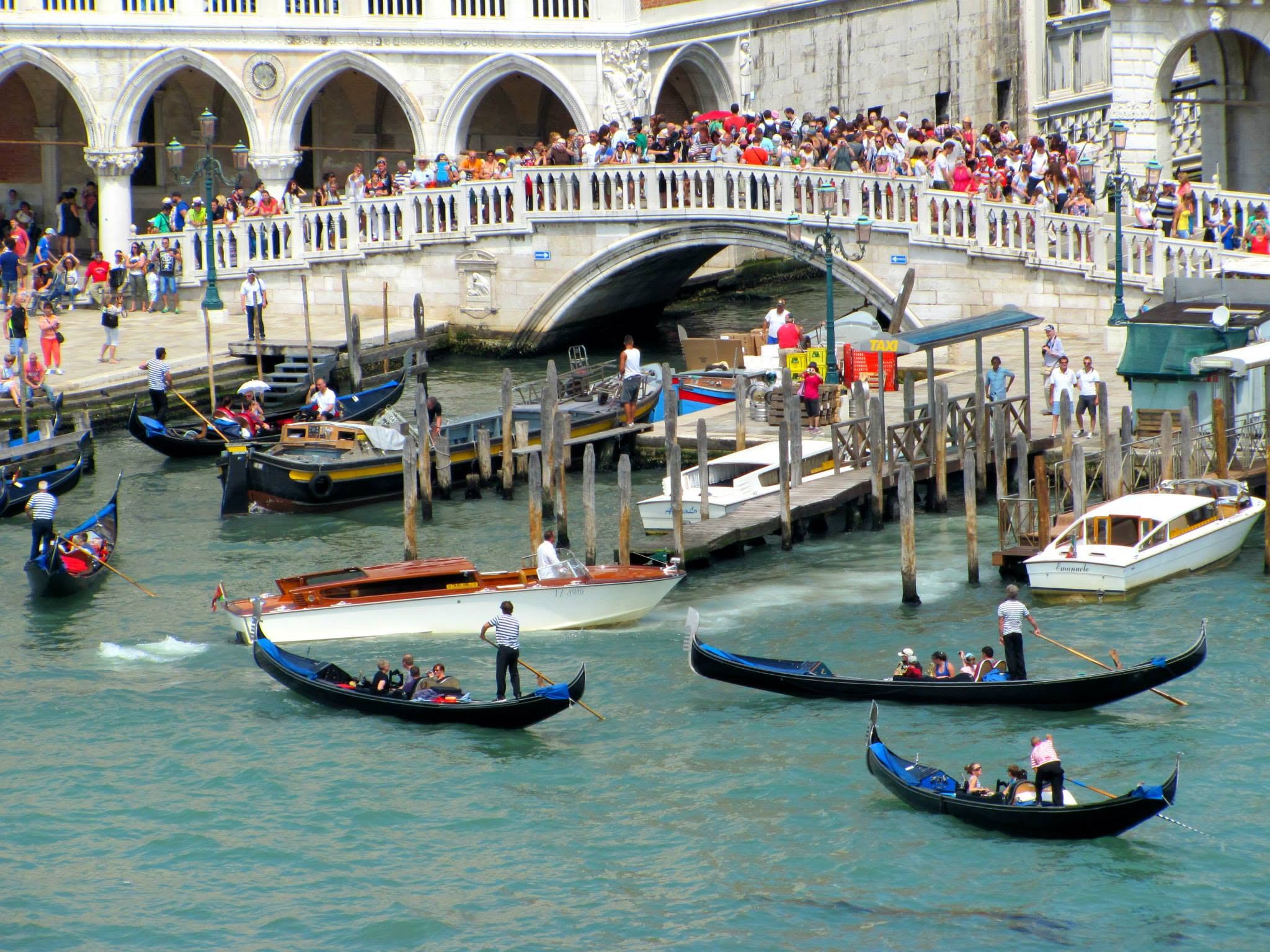 Gondolas and crowds on the bridge by the Doge's Palace