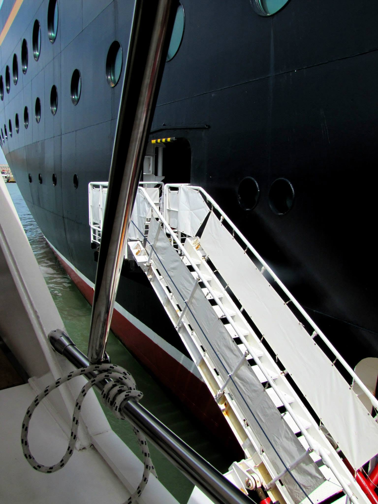 Boarding the panoramic cruise boat beside the Magic