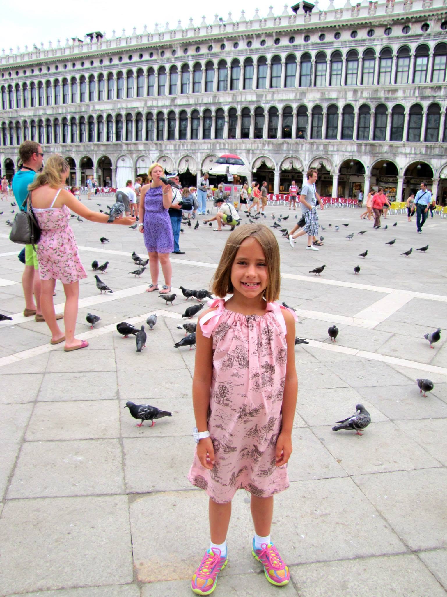 Lisa chasing pigeons in St. Mark's Square