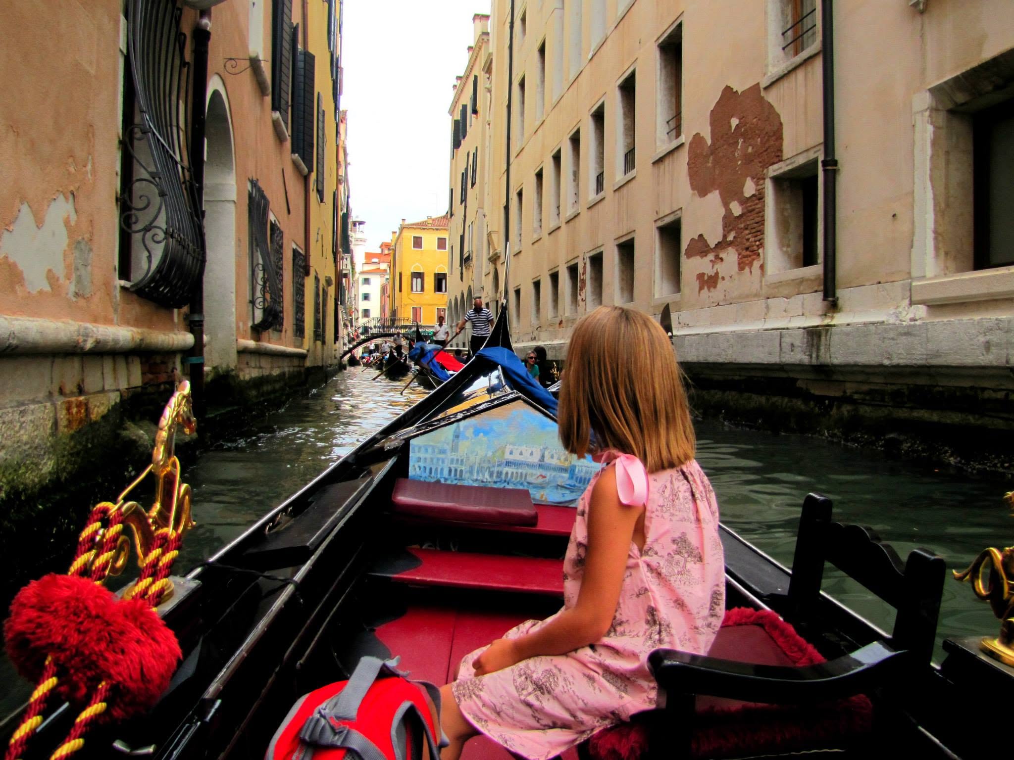 Lisa in the gondola on a quiet side canal