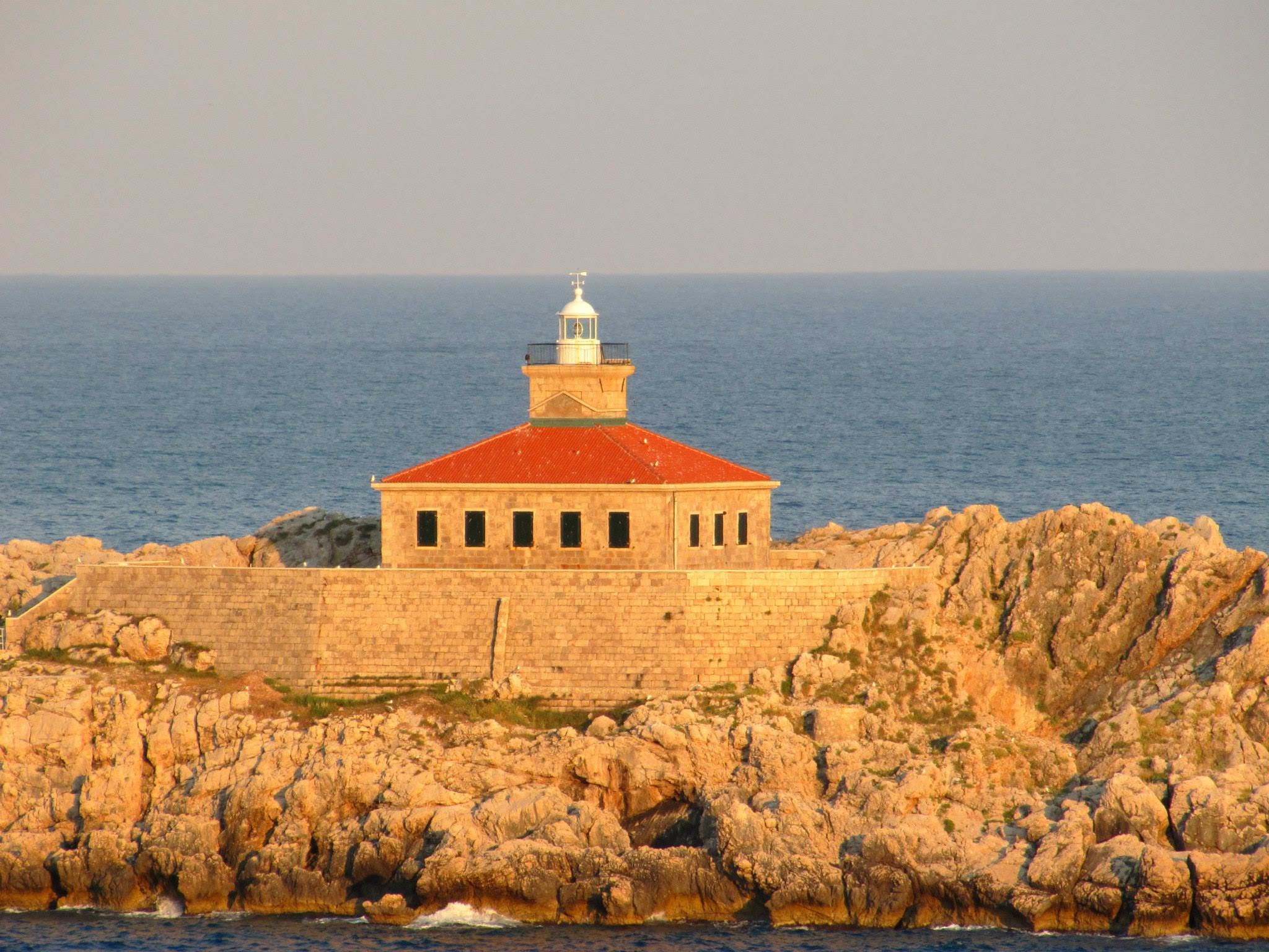 An island lighthouse from the upper deck leaving Dubrovnik
