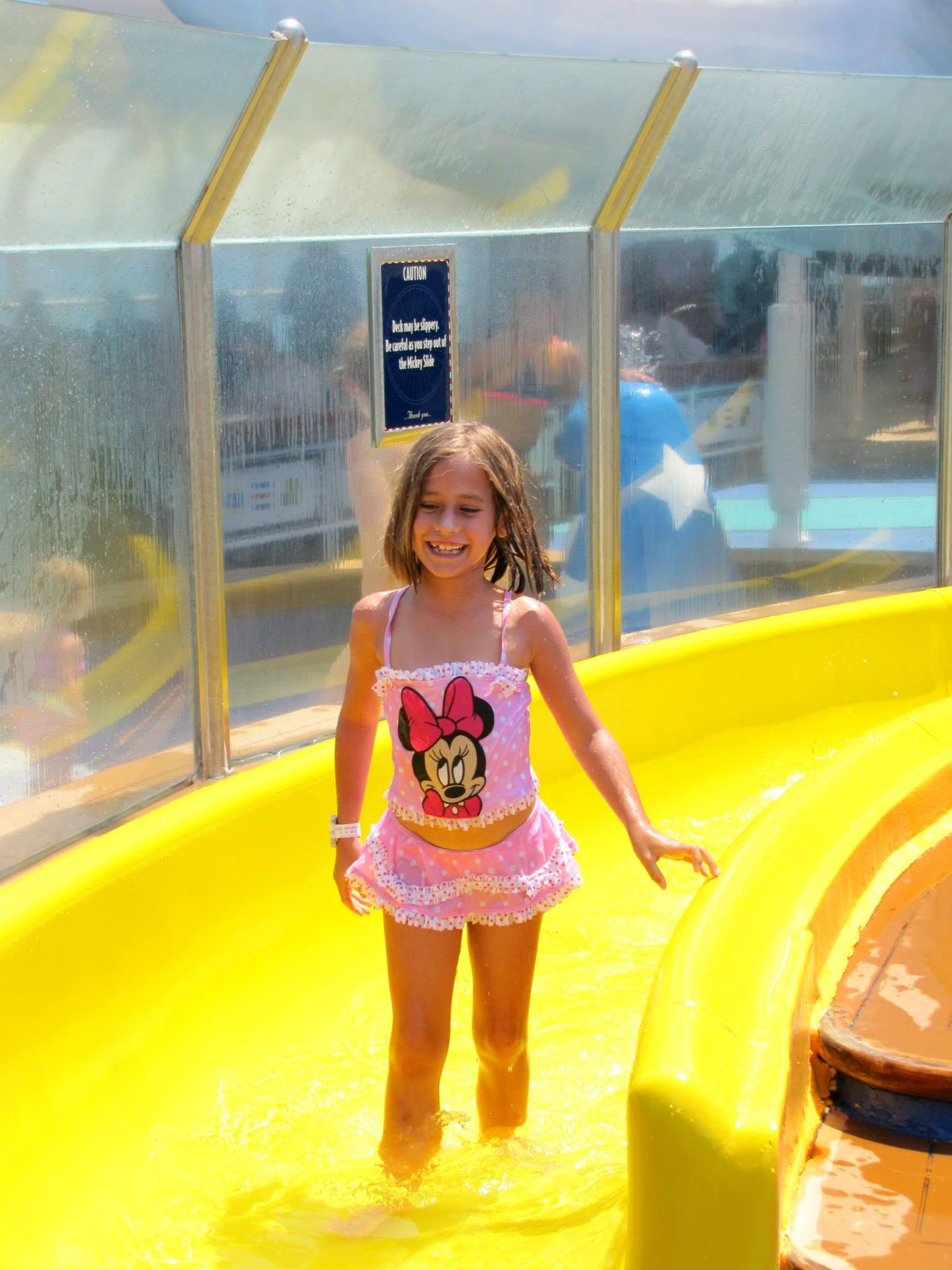Lisa trying the slide at Mickey's Pool