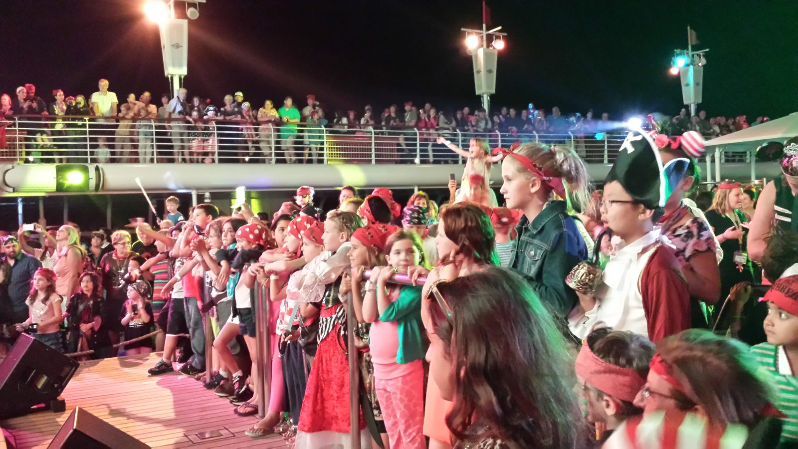 Kids cheering at the Pirate Night deck party