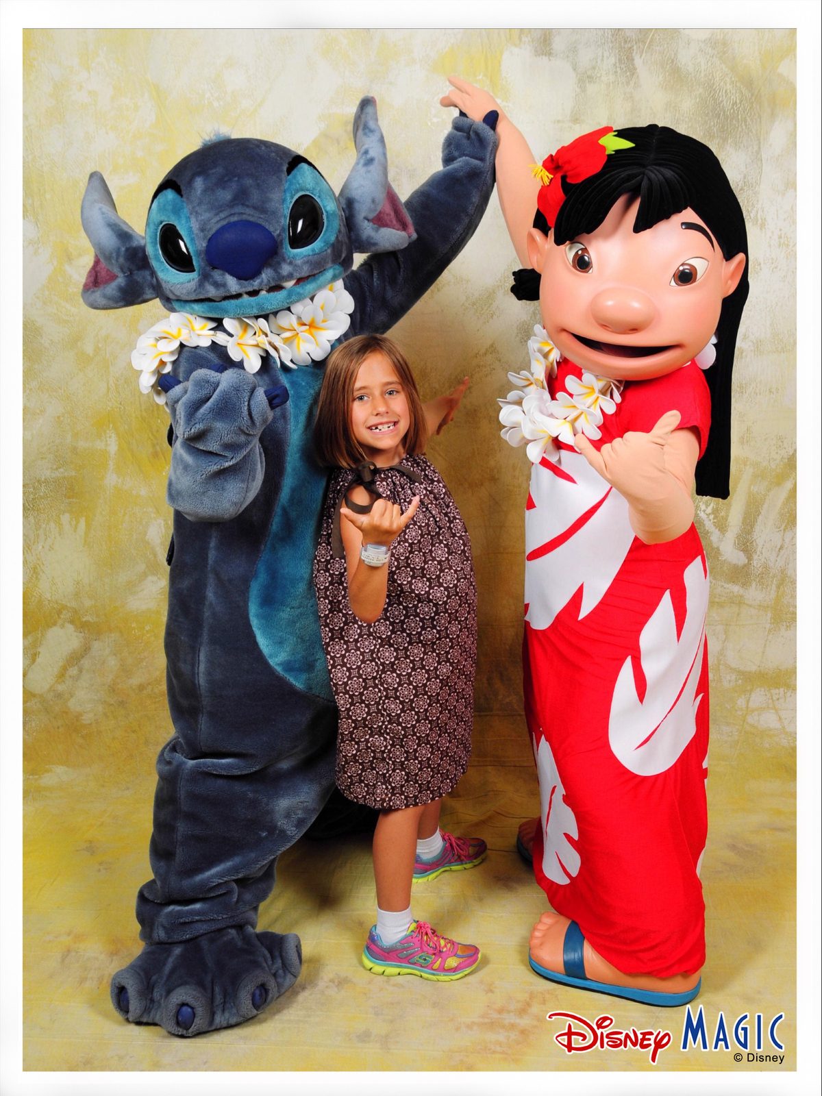 Stitch in his flower lei, Lisa and Lilo