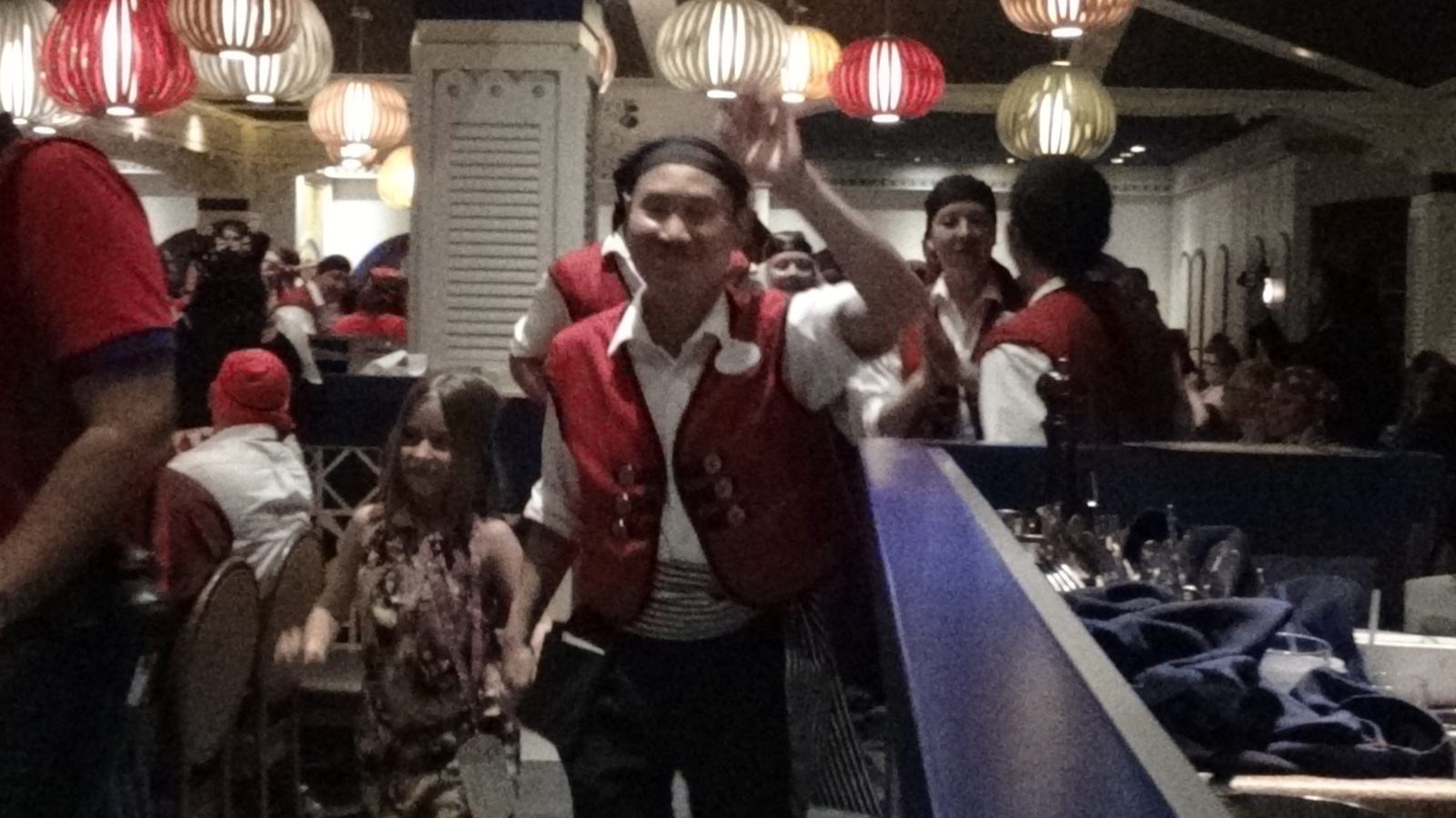 Costumed servers dancing through the dining room