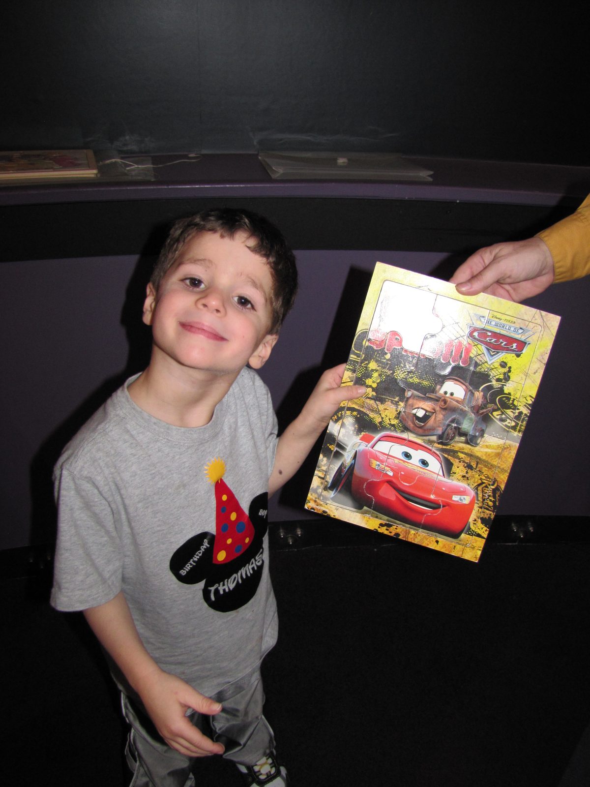Thomas smiling with his new book
