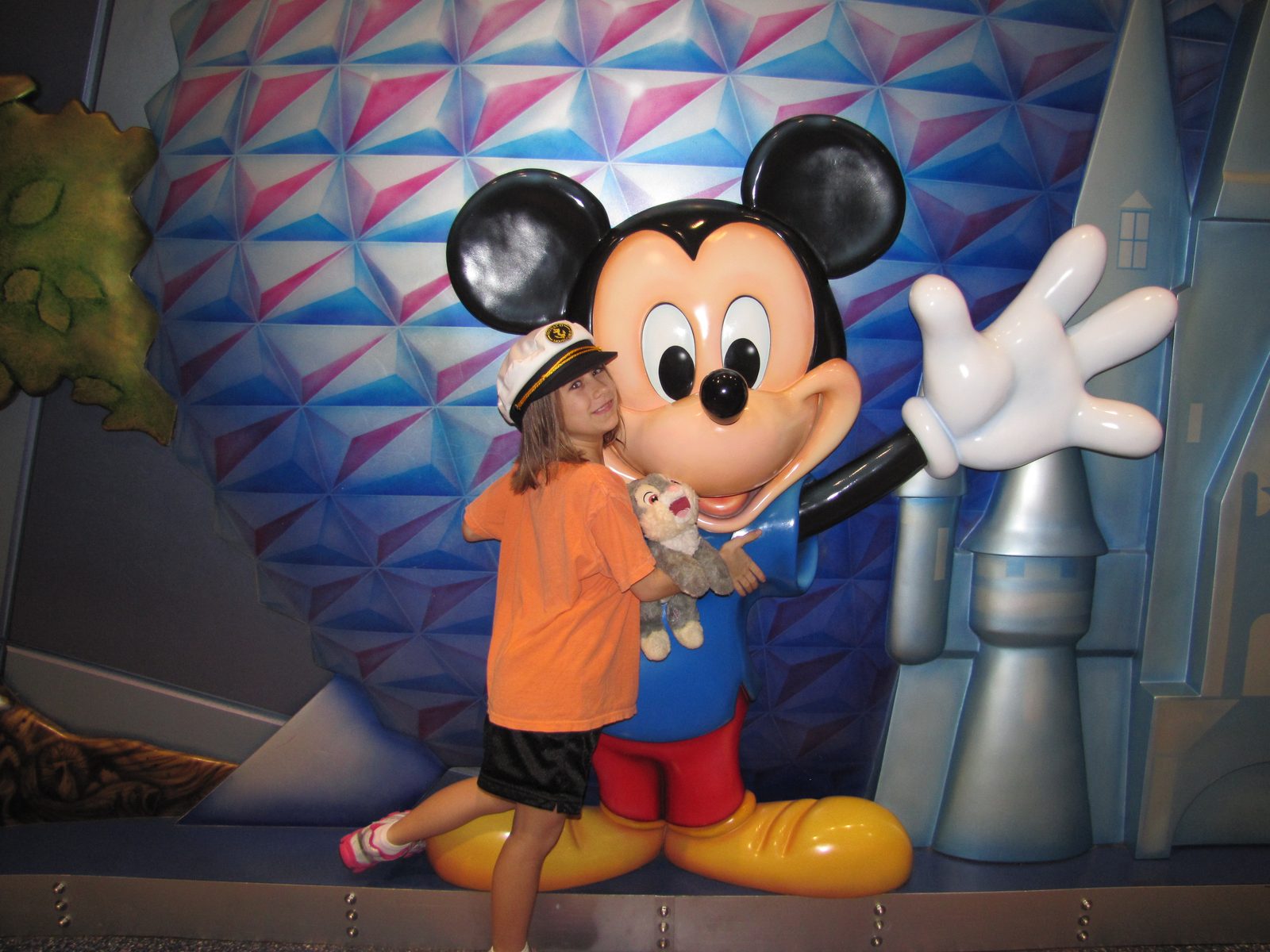 Lisa hugging Mickey at the airport Disney store