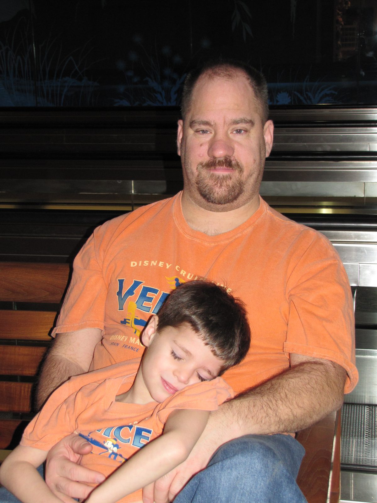 Thomas asleep on my lap before the bus came
