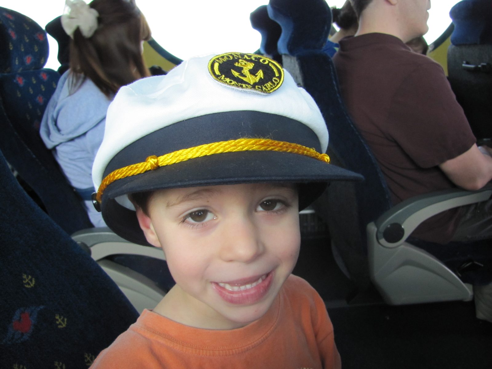 Thomas wearing his sister's hat on the bus