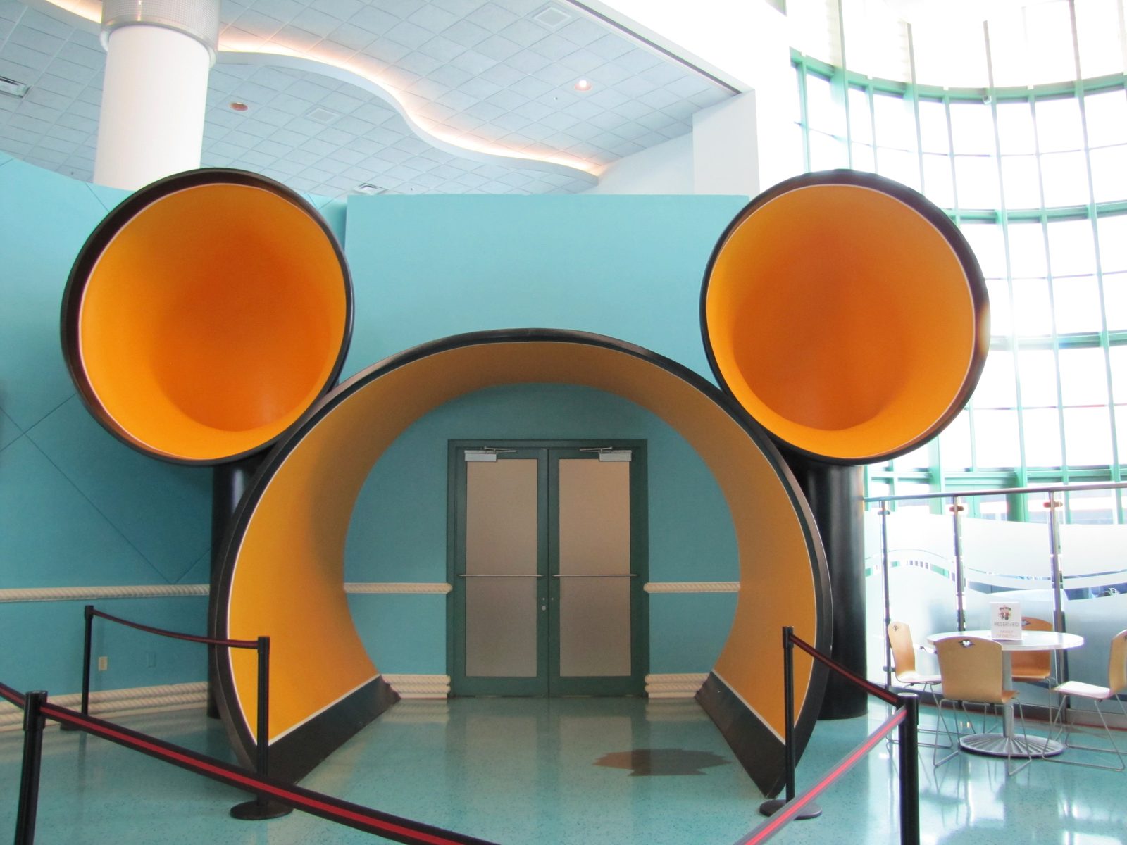 Through the archway shaped like Mickey's ears