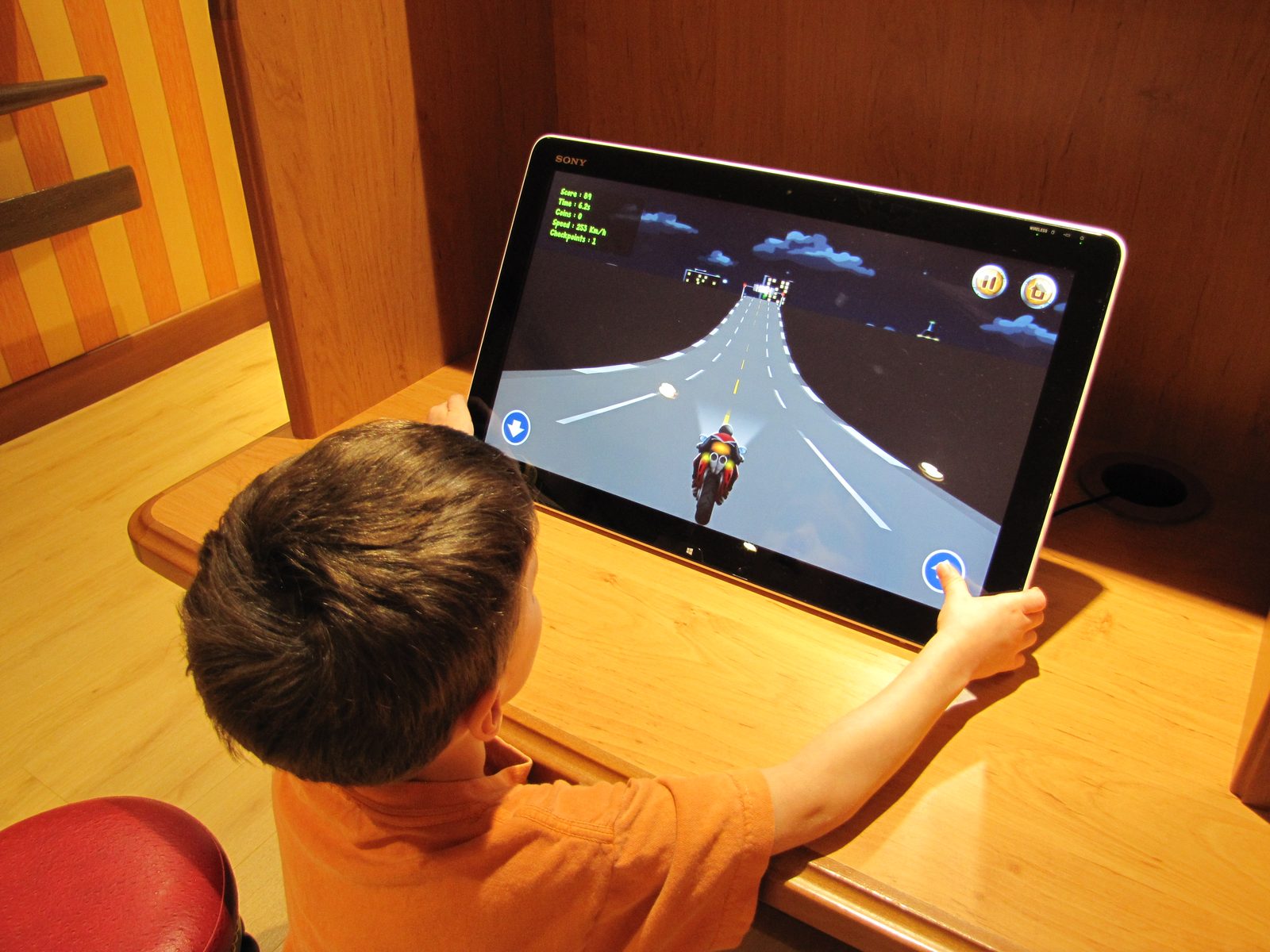 Thomas playing the Avengers Academy game