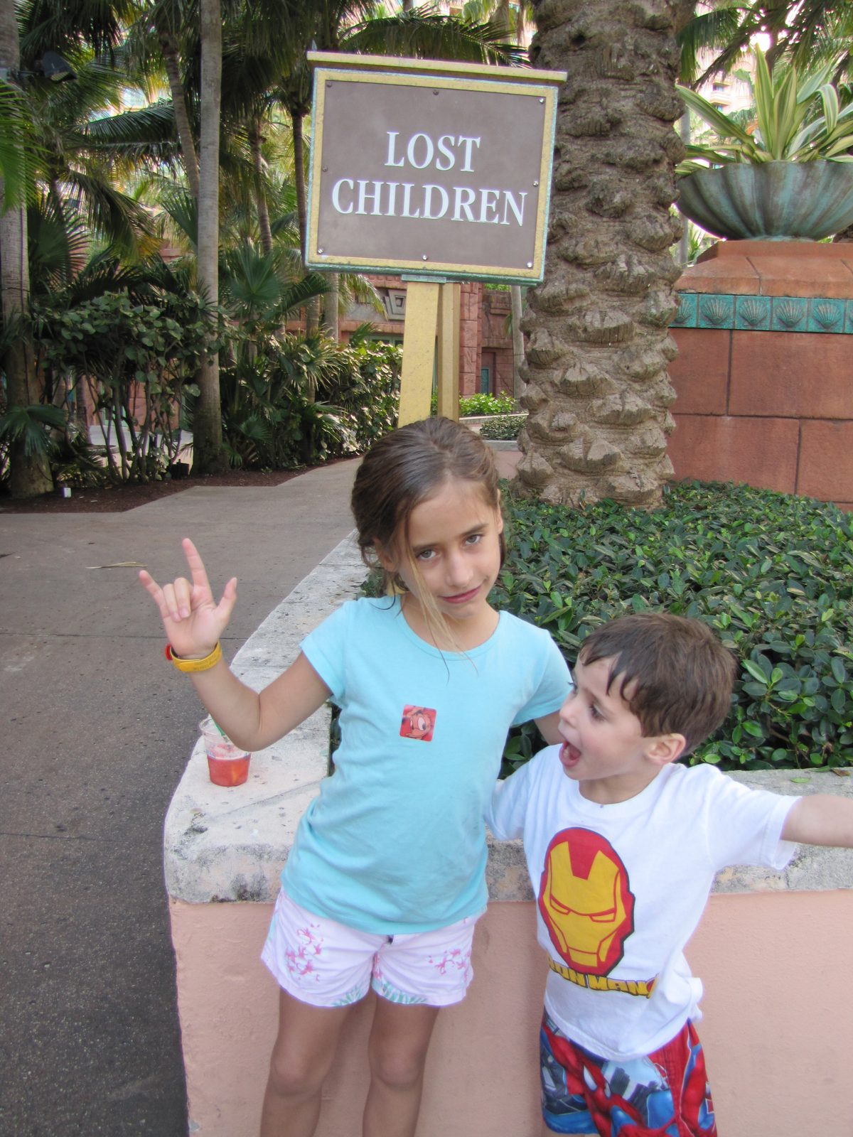 Lisa signing I love you near the Lost Children sign