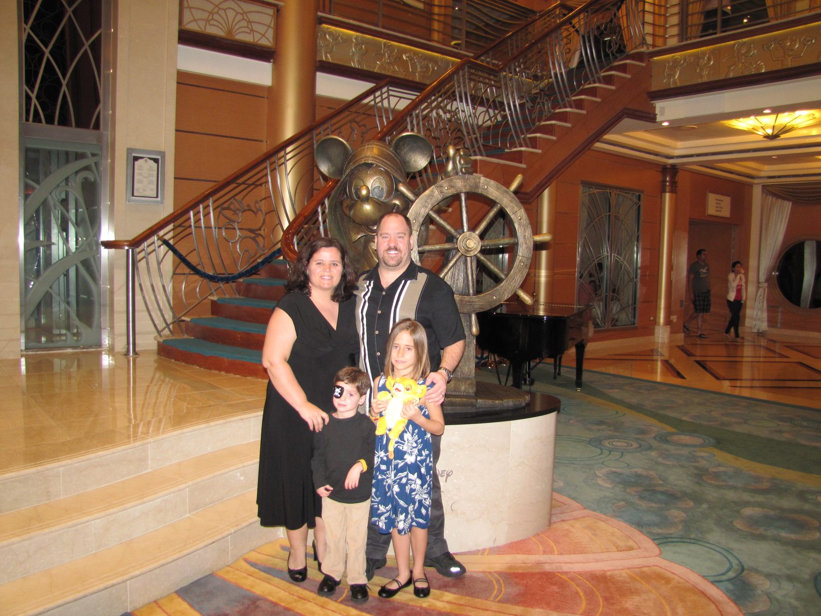 The family dressed up for optional dress up night on the staircase
