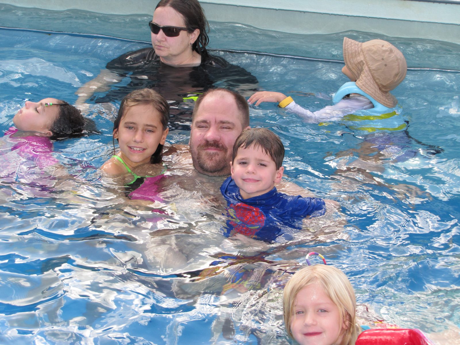 The whole family together in the pool