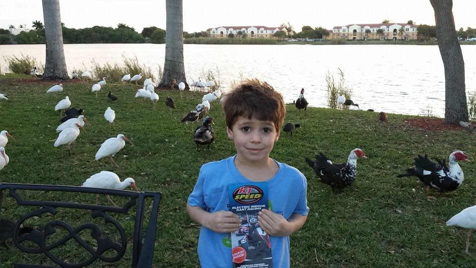 Thomas with the ibis and ducks by the hotel lake