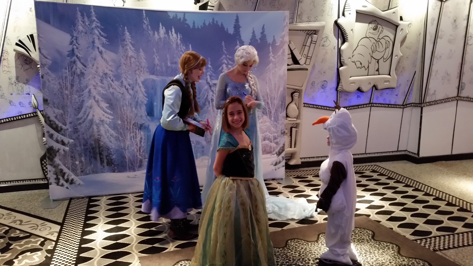 Anna, Lisa in her Anna dress and Elsa with Thomas dressed as Olaf
