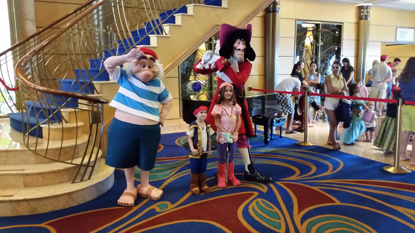 Mr. Smee, Thomas, Lisa and Captain Hook by the grand staircase in the Lobby Atrium on Pirate Night