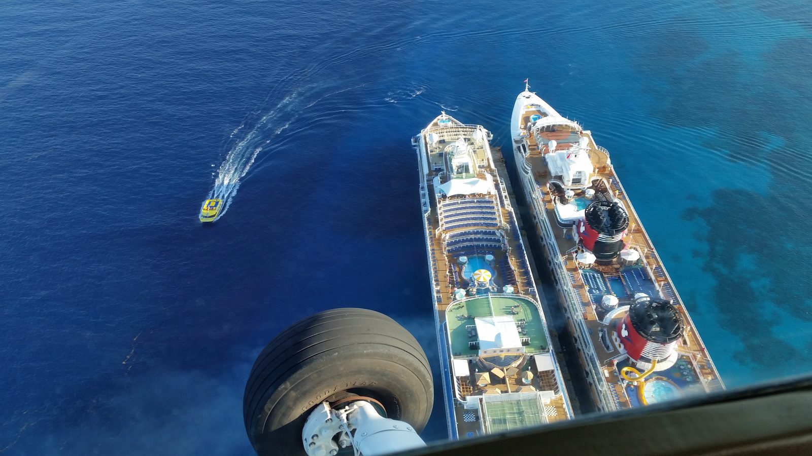 The Wonder and the Norwegian Dawn from above