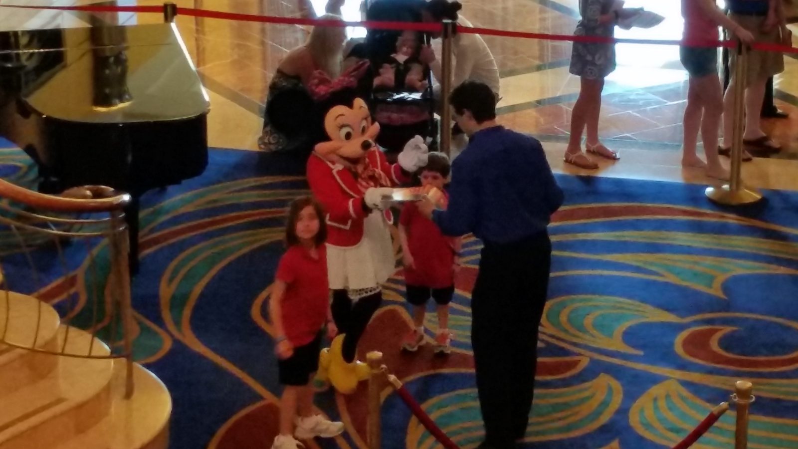 Lisa, Minnie Mouse in her sailor outfit and Thomas in the Lobby Atrium