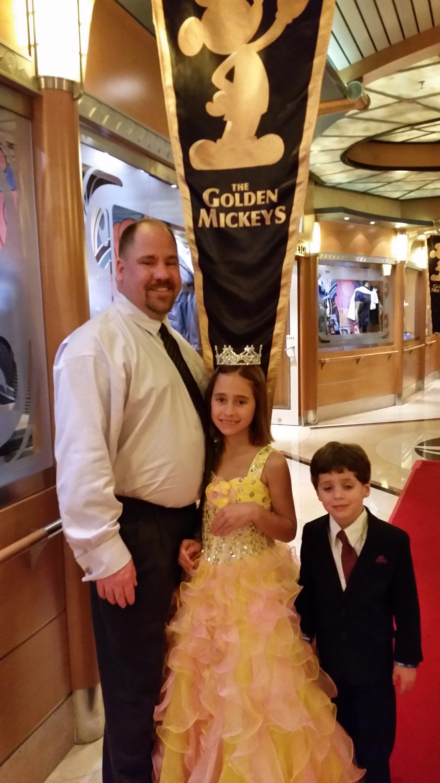 Michael, Lisa and Thomas under the Golden Mickeys banner