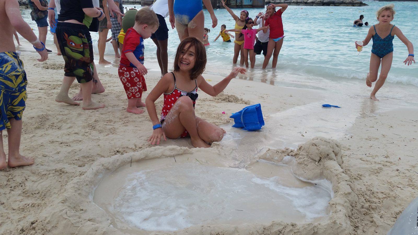Lisa at the sandcastle moat on Castaway Cay