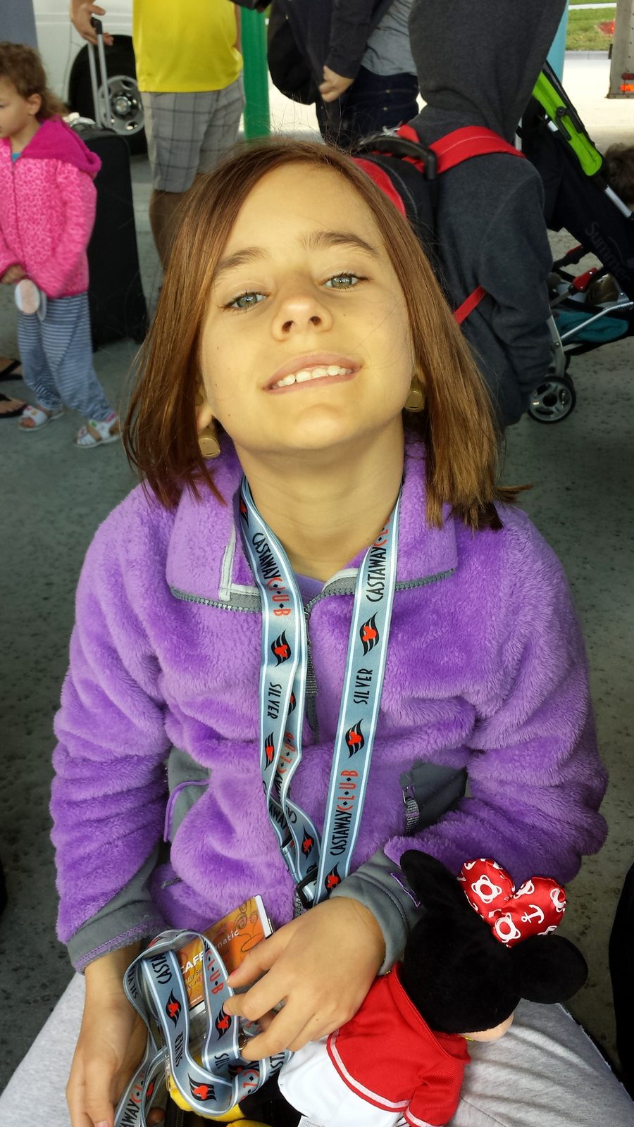 Lisa with her mouse ears, disembarking