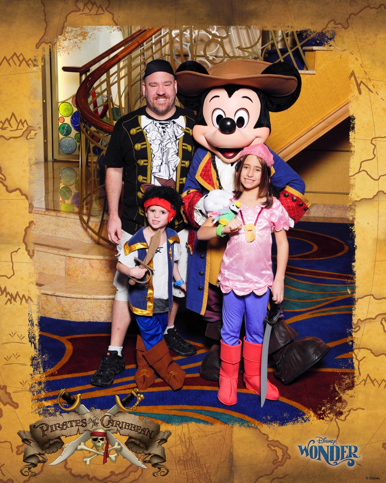 Michael, Thomas, Mickey Mouse in pirate garb and Lisa on Pirate Night in the Lobby Atrium