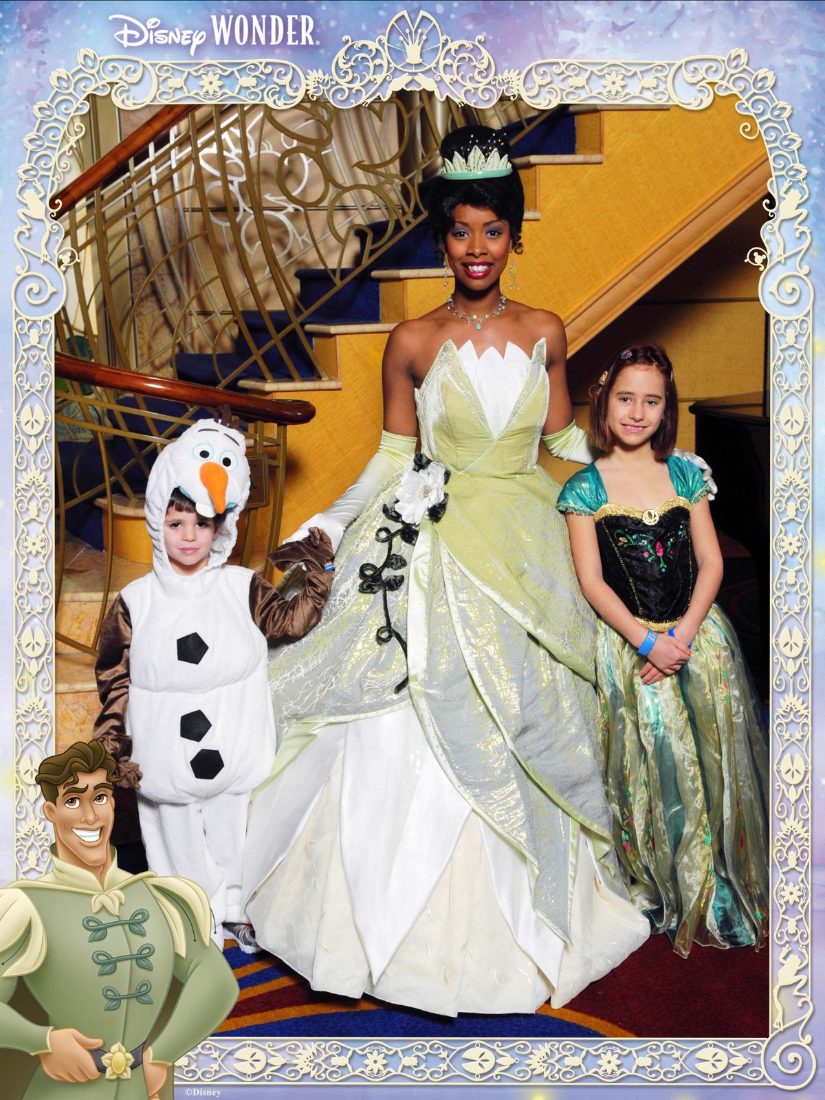 Thomas dressed as Olaf, Tiana and Lisa in her Anna dress in the Lobby Atrium