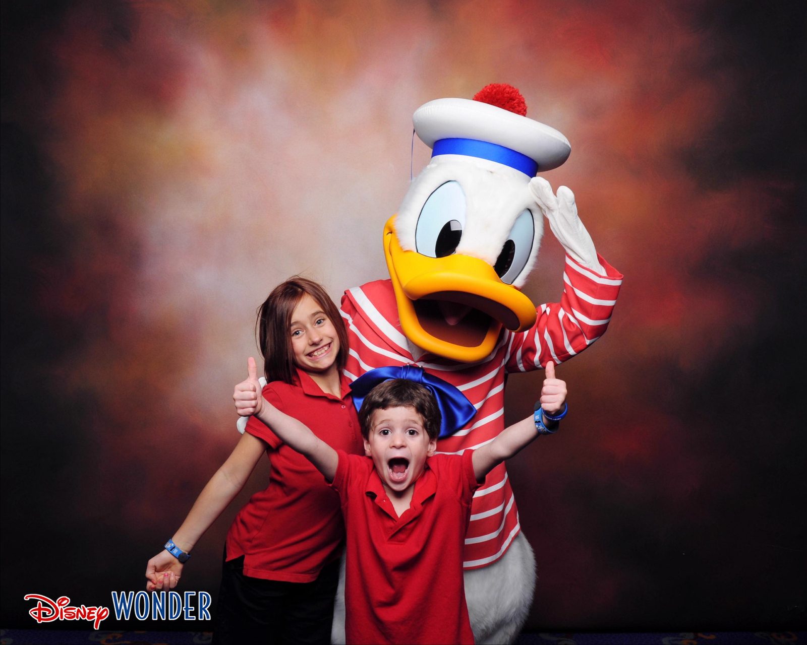 Lisa and Thomas pose with Donald Duck