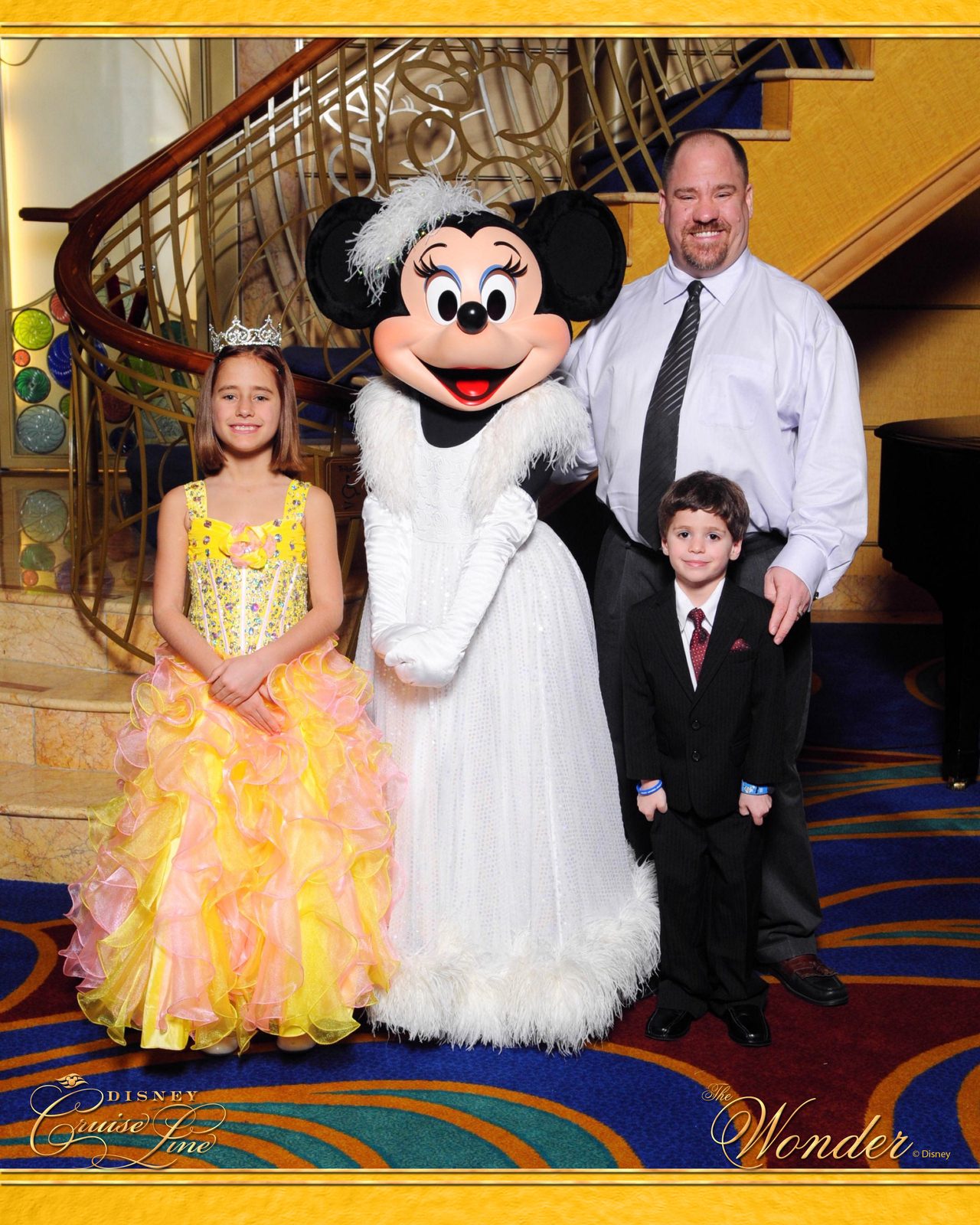 Lisa, Minnie Mouse in her formal gown, Michael and Thomas on Formal Night in the Lobby Atrium