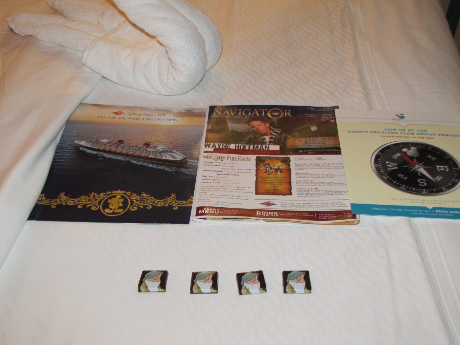 The day's Personal Navigator laid out on our bed