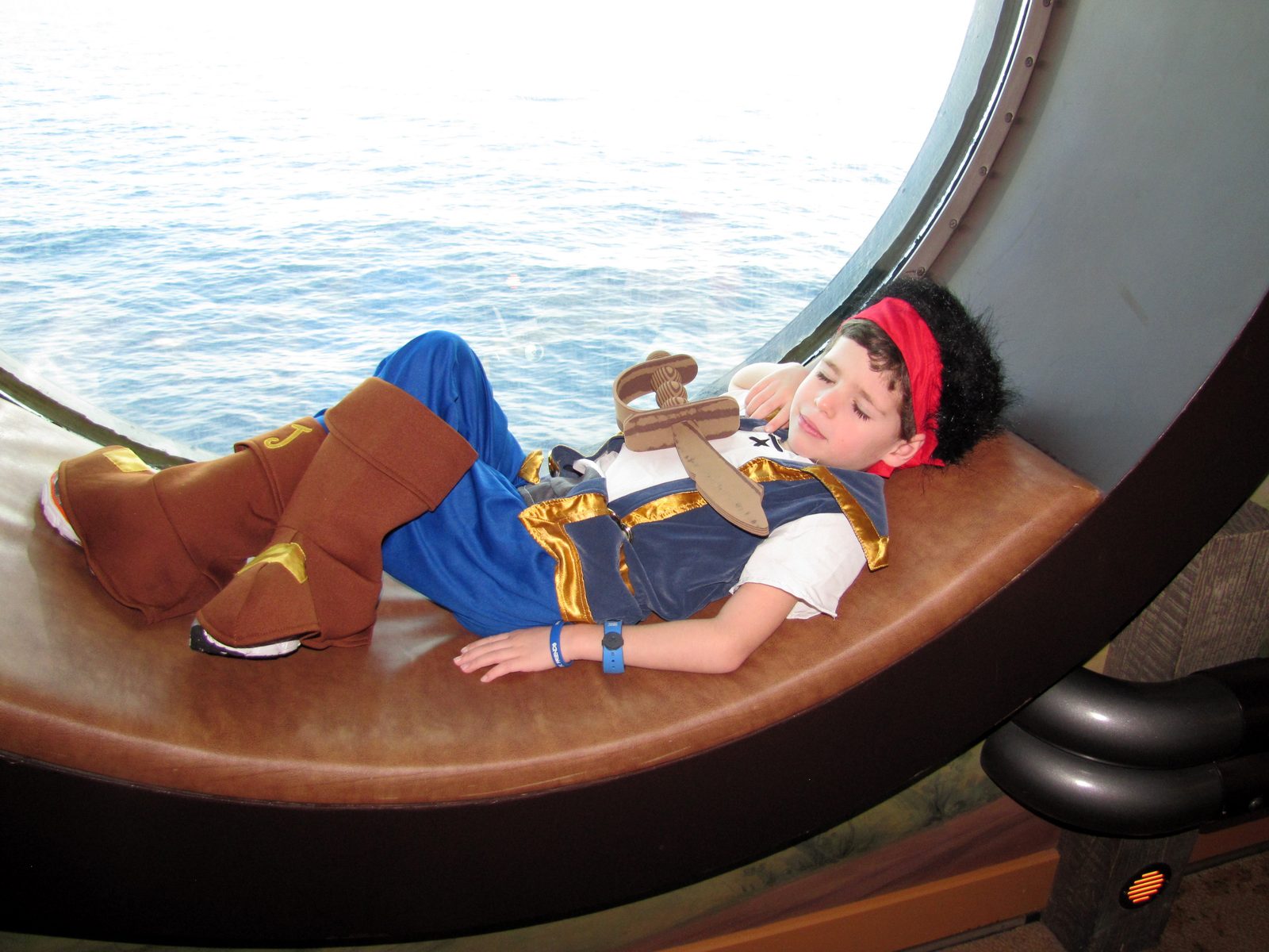 Thomas as Jake in a porthole seat on the Wonder