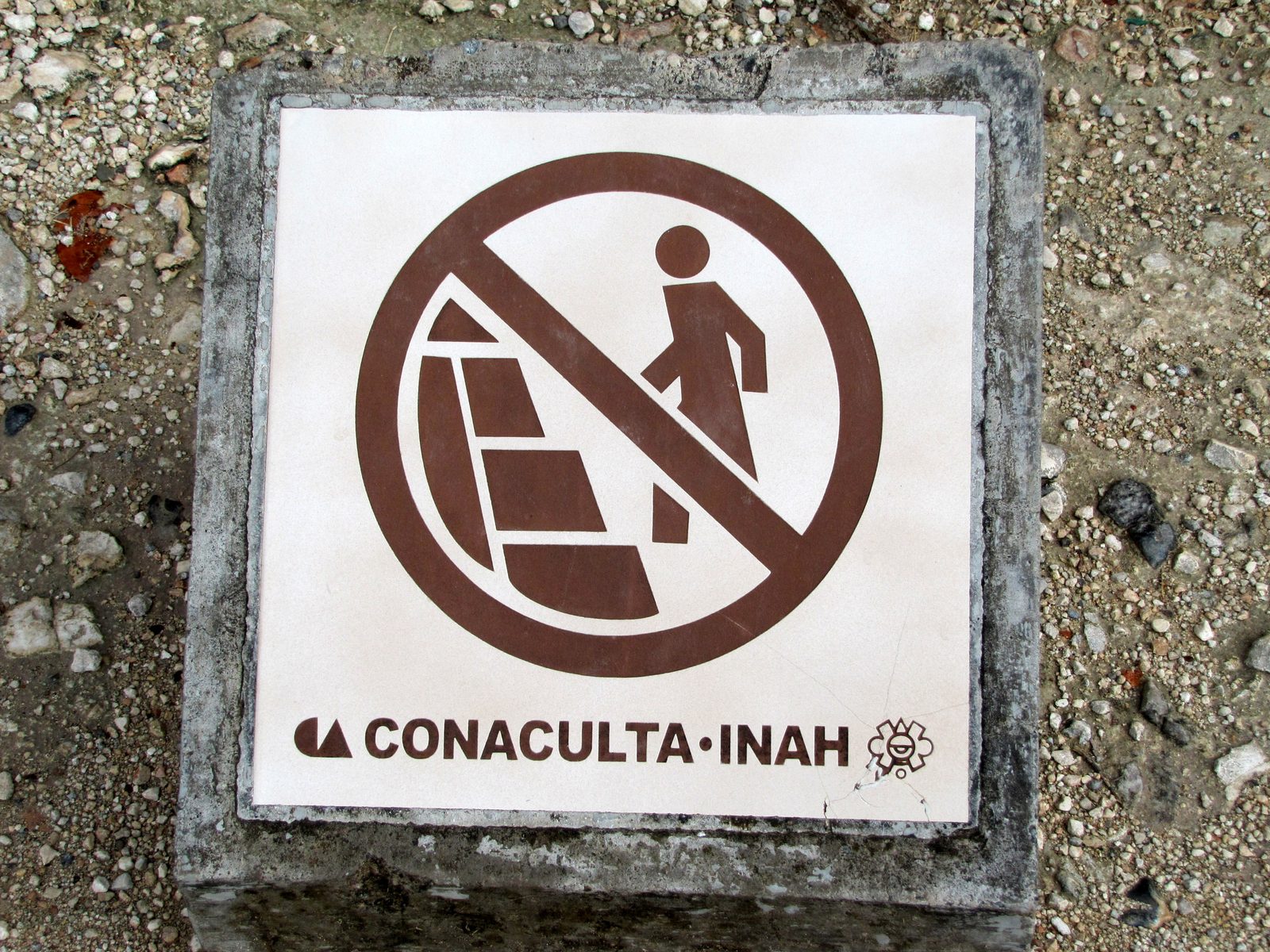 A sign asks visitors not to climb