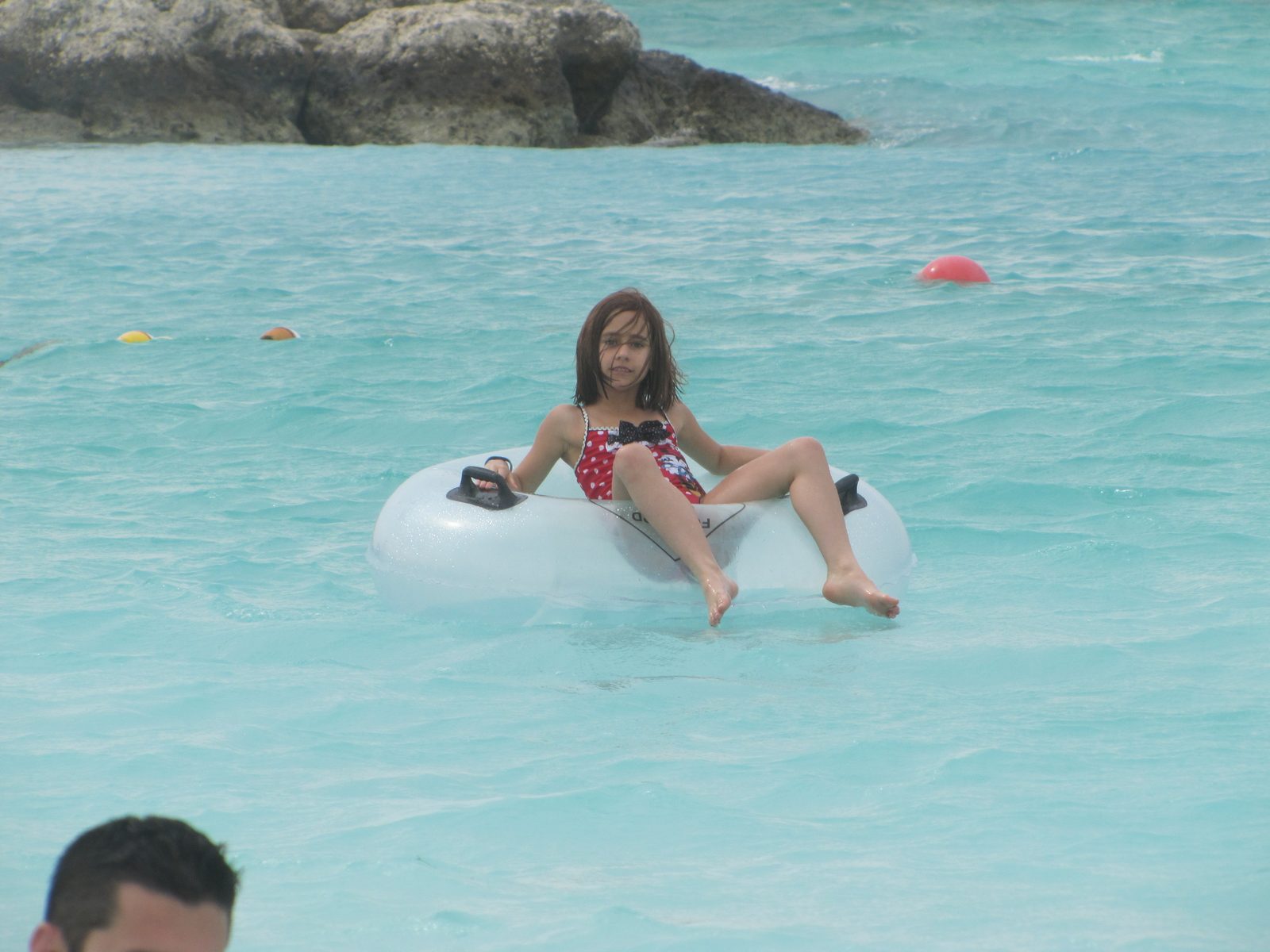 Lisa floating on a tube at Castaway Cay