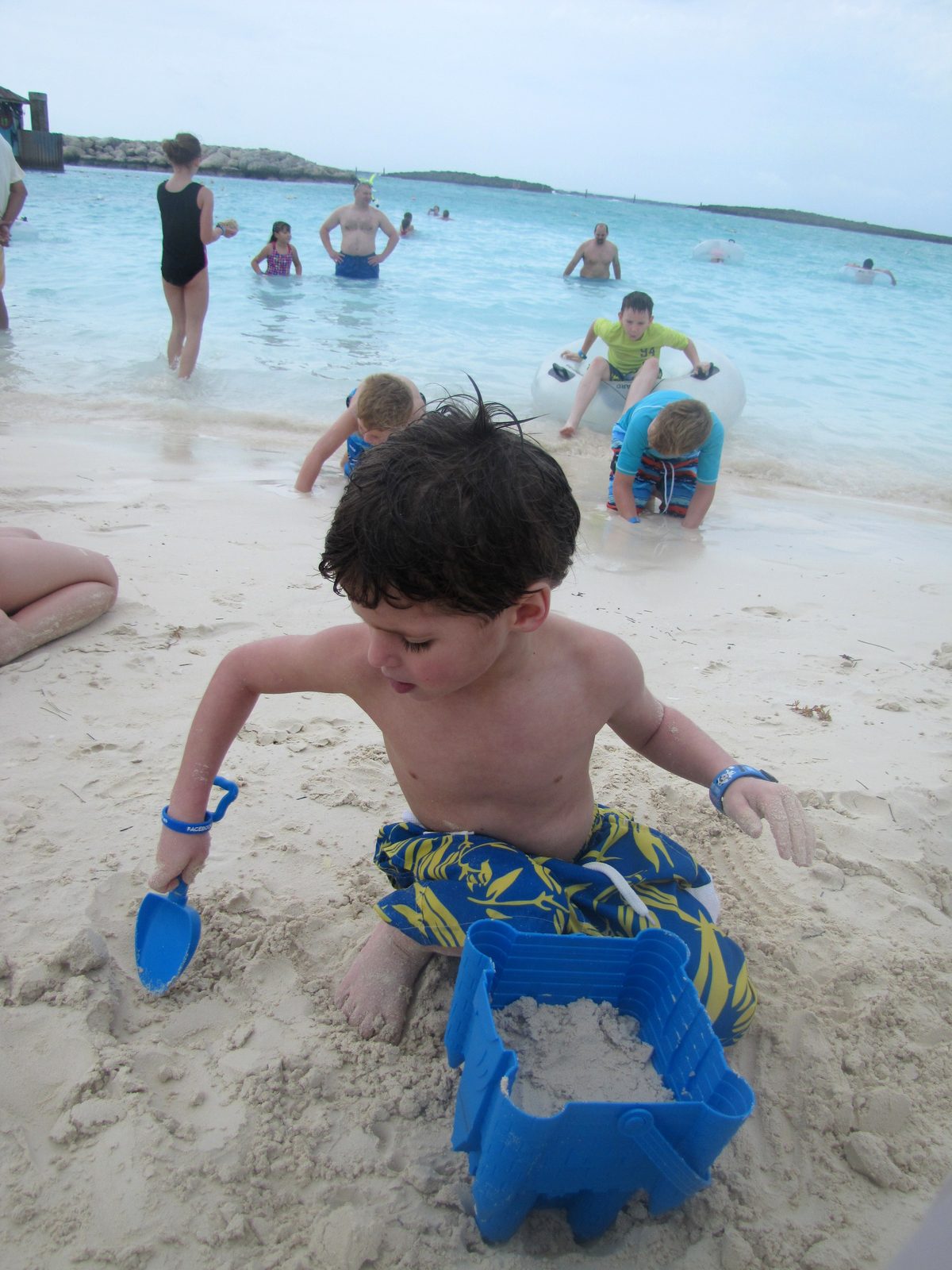 Thomas building a sandcastle before the rain