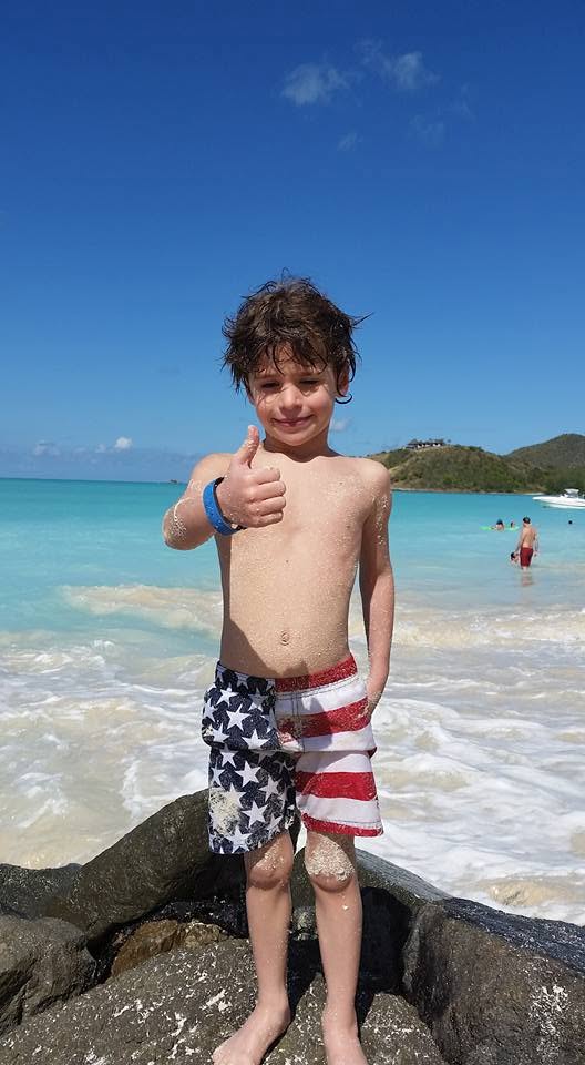 Thomas with a thumbs up at Jolly Beach
