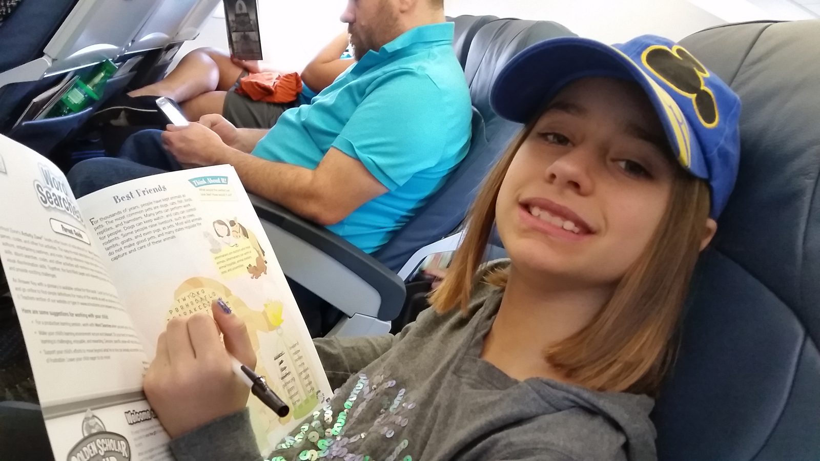 Lisa reading on the flight to San Juan