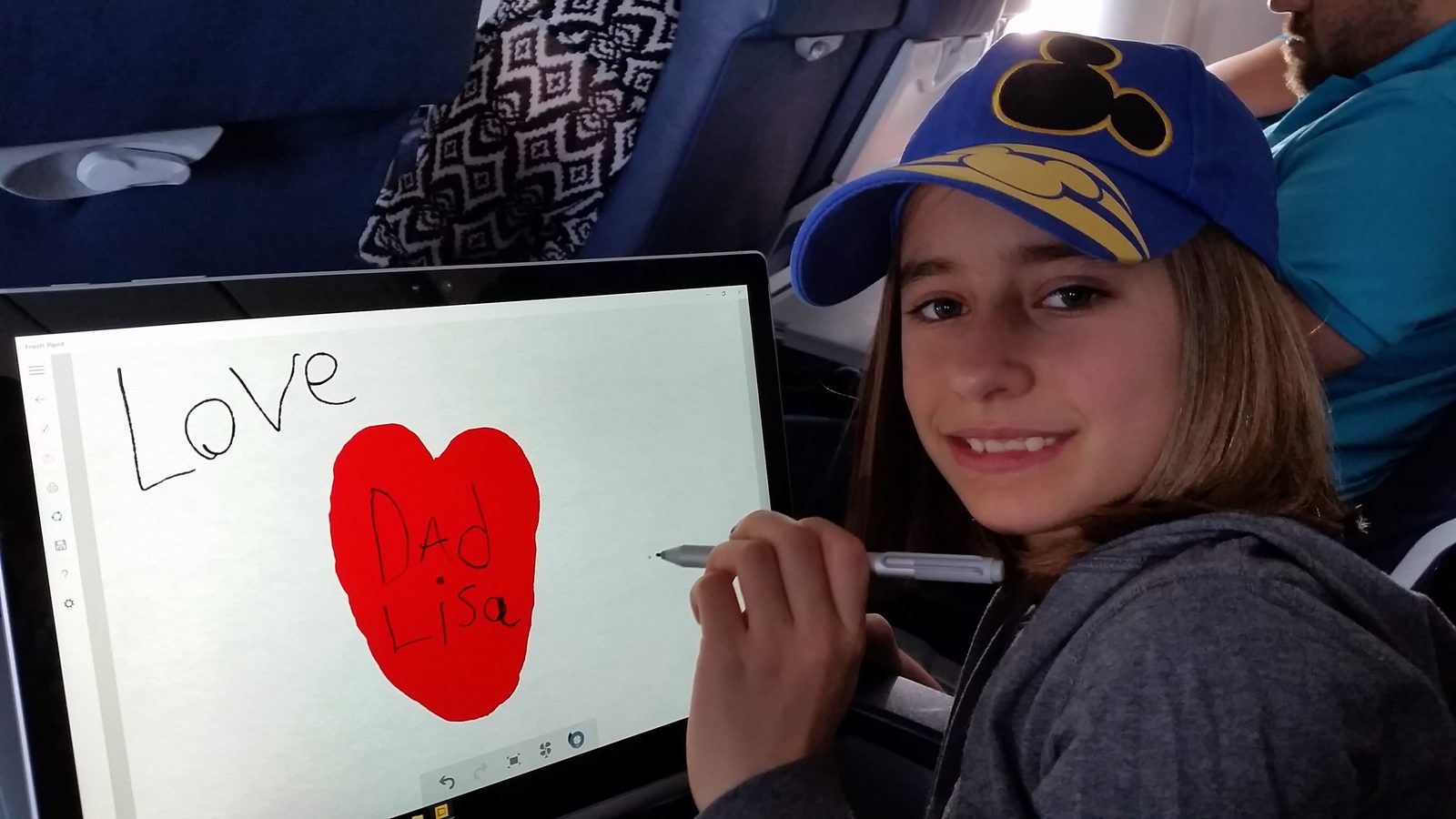 Lisa draws me a heart that says Love Dad