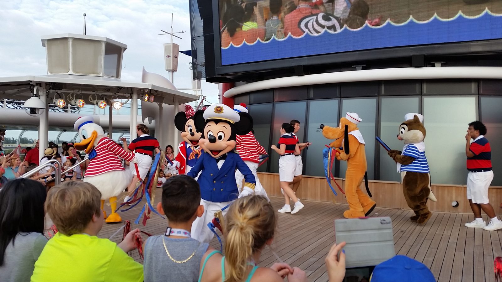 Donald, Captain Mickey, Pluto and Chip in sailor outfits at the Adventures Away deck party