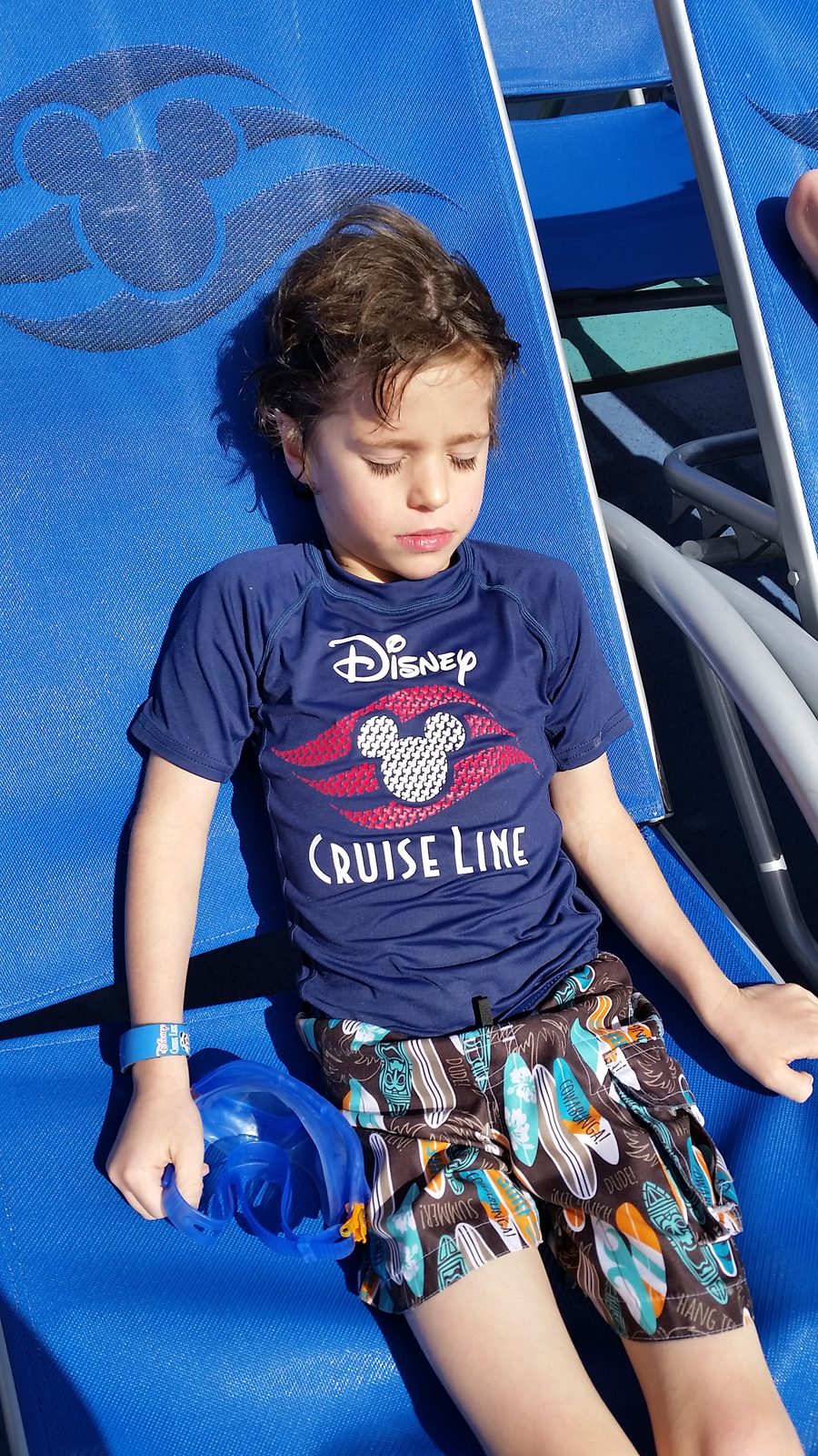 Thomas asleep on a deck chair on our day at sea