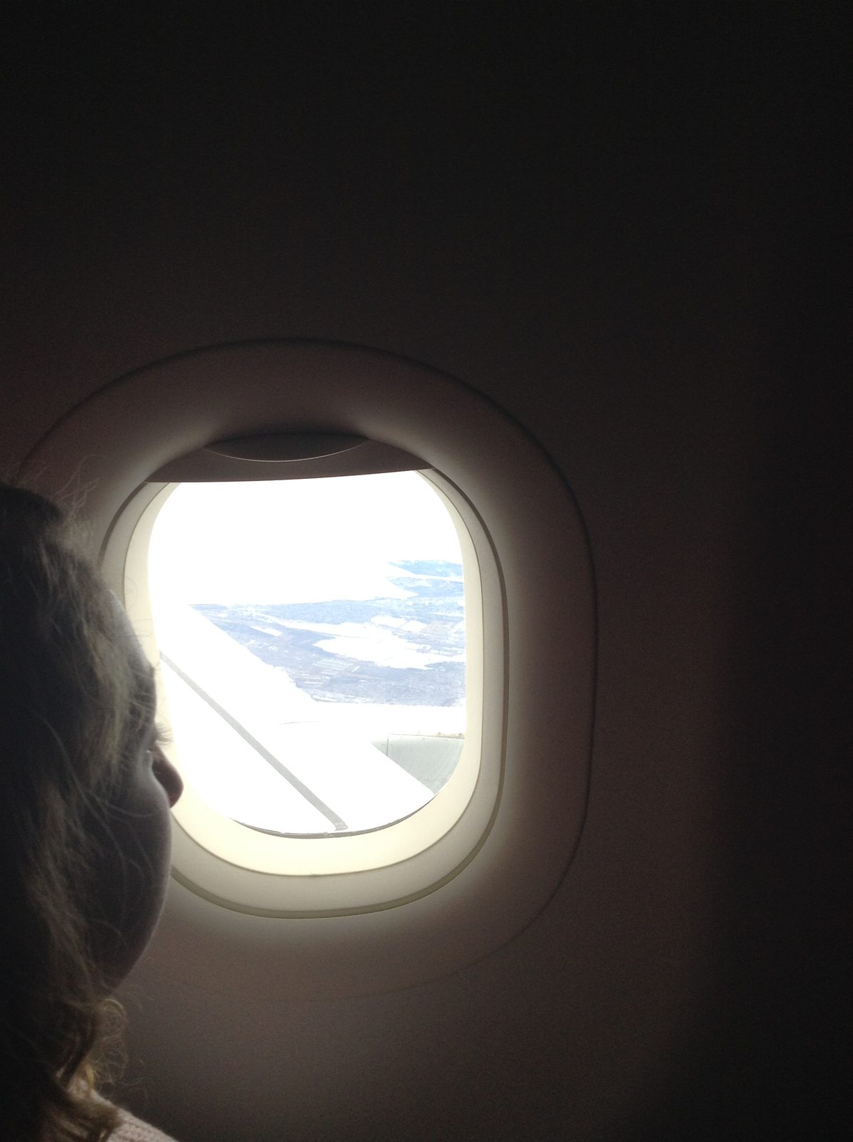 A window seat view somewhere over the clouds