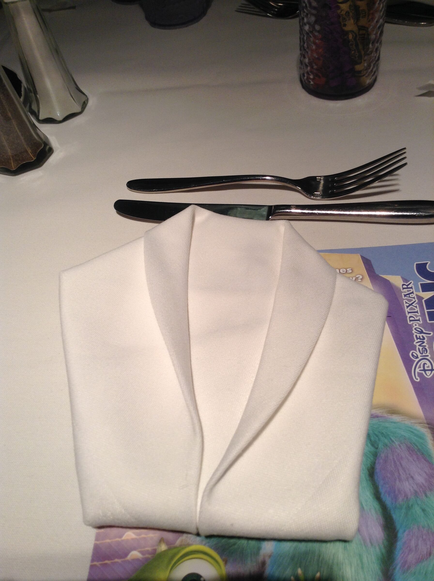 Napkins folded like tuxedo shirts at Animator's Palate