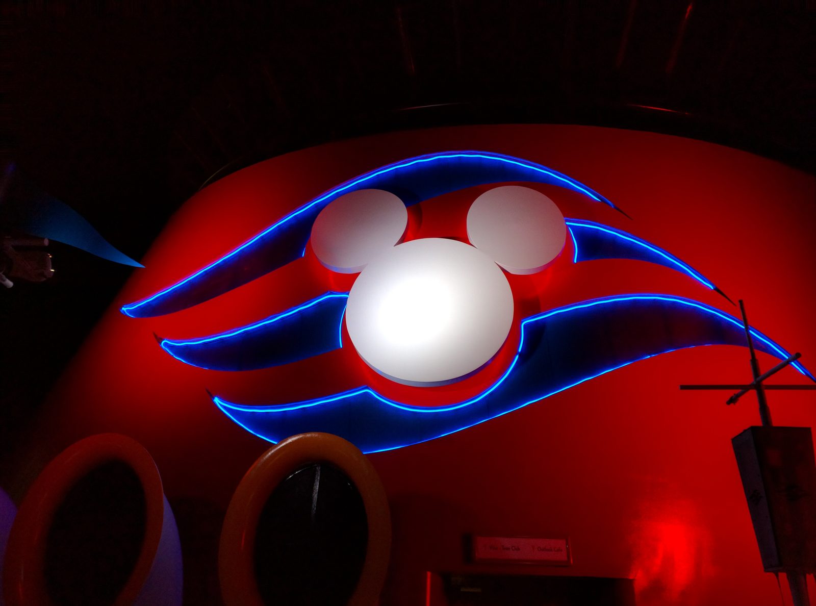 The Mickey logo lit up on the Wonder at night