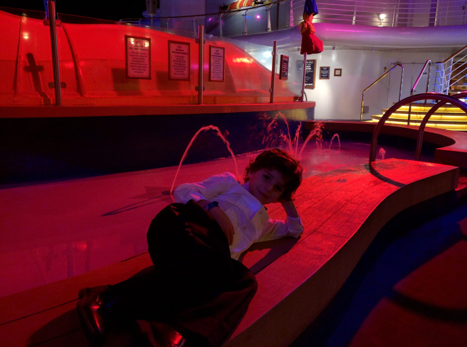 Thomas by the pool fountain after dinner