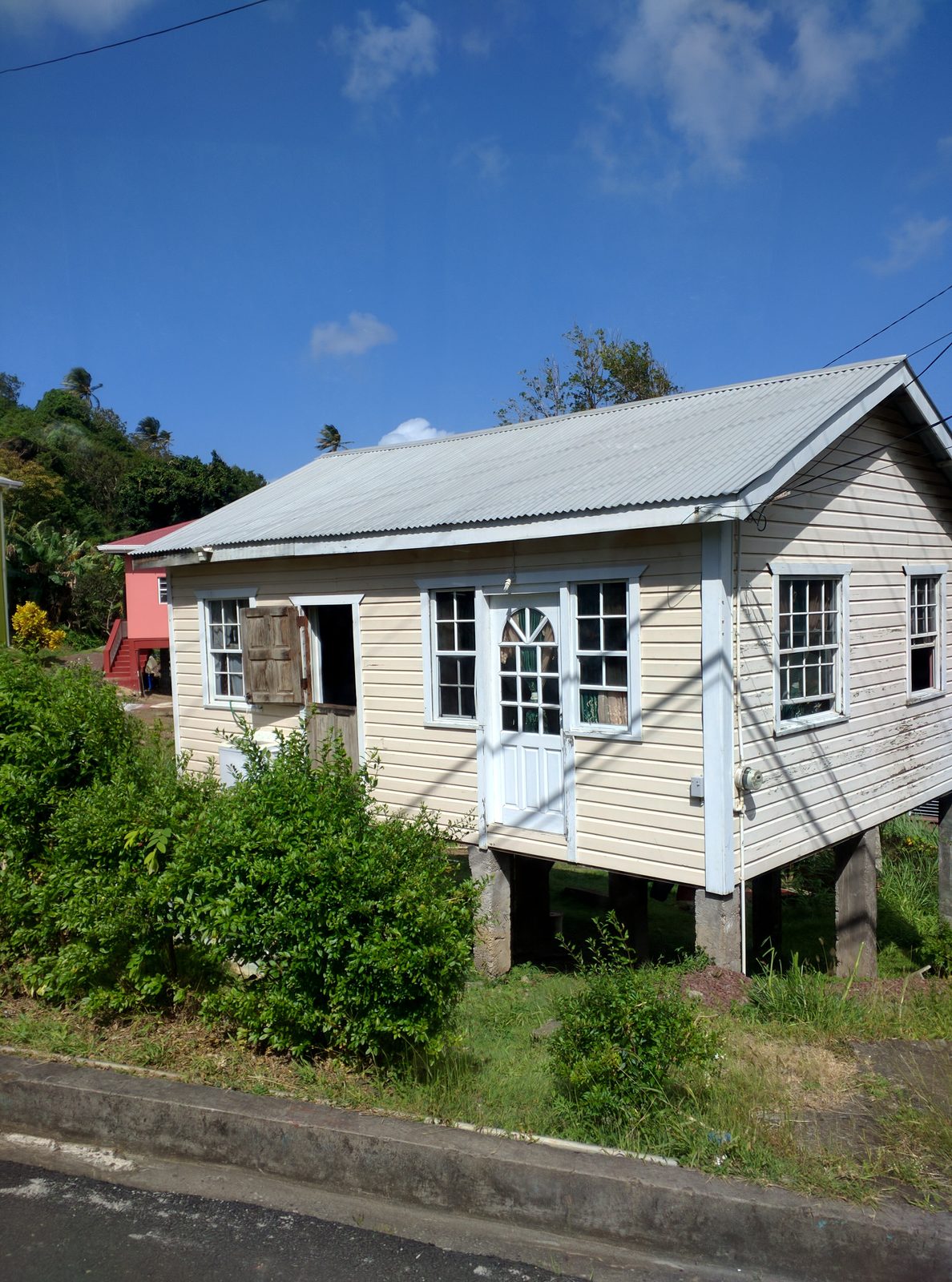 A wooden house along the road in Grenada