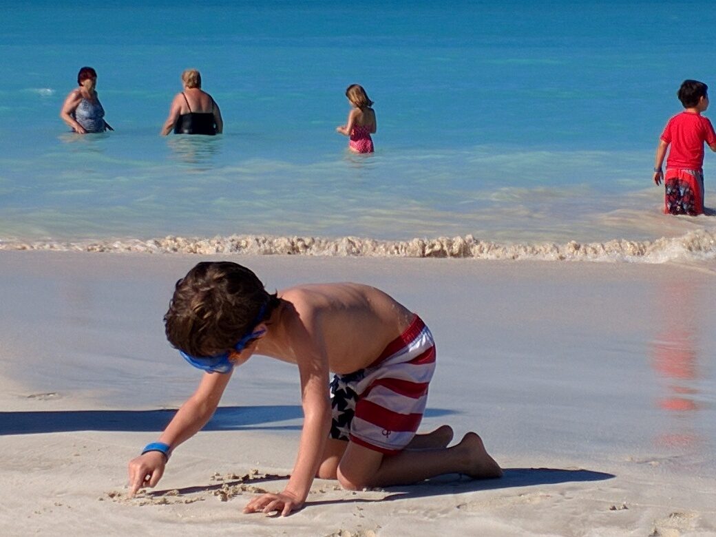 Thomas digging in the sand at Jolly Beach
