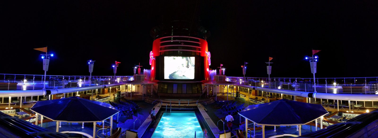 The pool deck at night on the Wonder