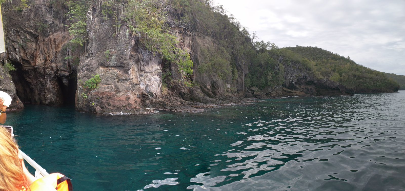 Sea caves and cliffs from the boat at Anse Noire