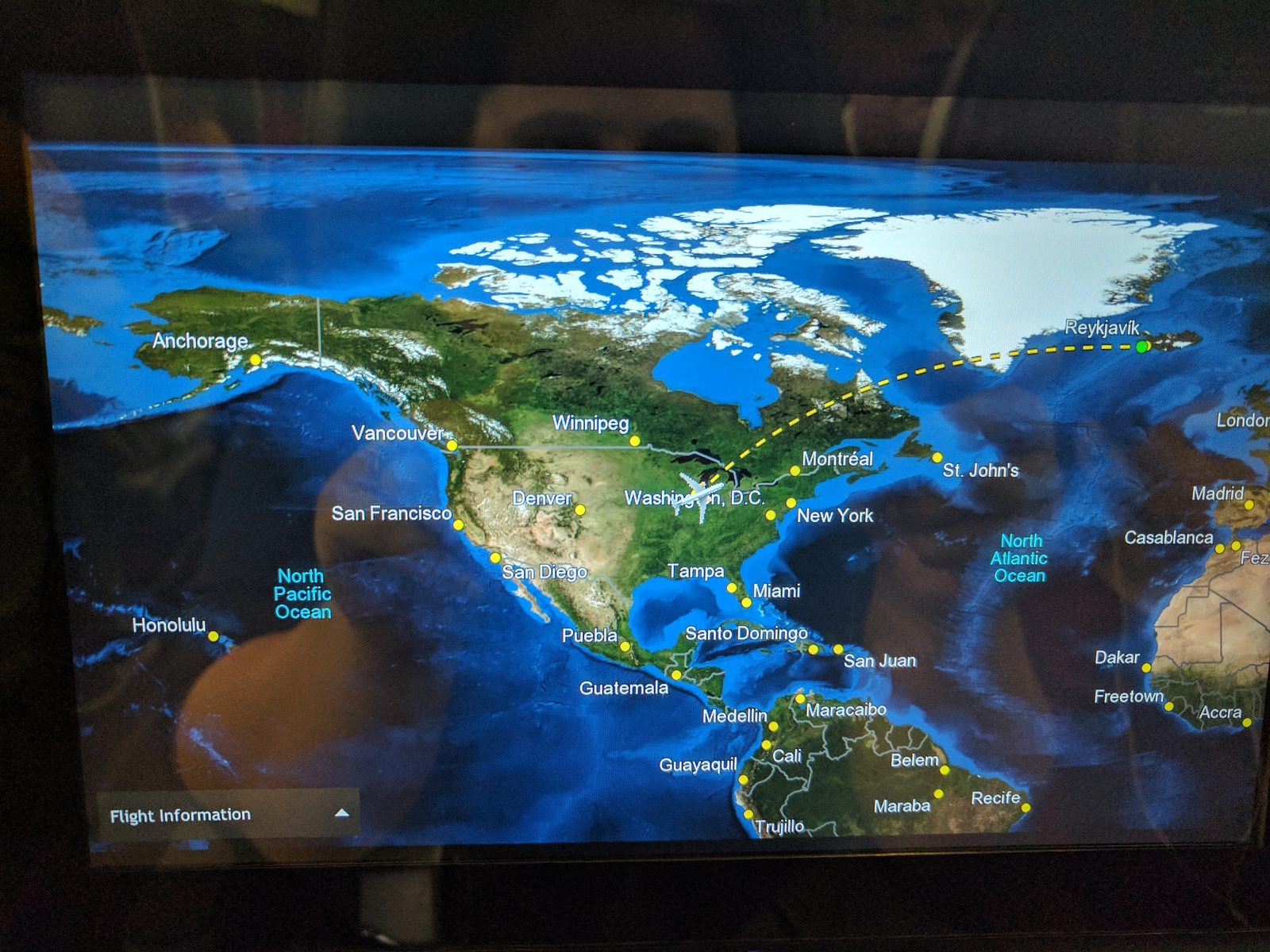 The flight path curling up over Canada toward Iceland